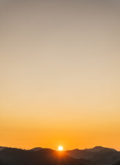 sunset vertical over the mountains