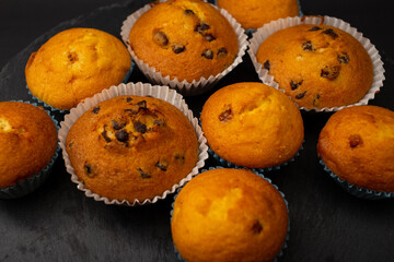 Juicy cupcakes on a black background, confectionery, bakery
