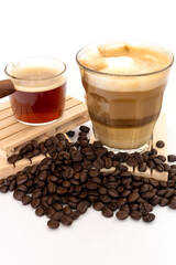 hot latte with coffee beans on white background