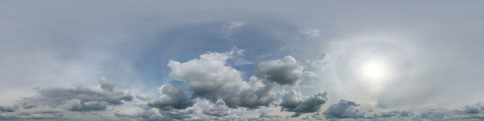 blue sky hdri 360 panorama with halo and white beautiful clouds in seamless panorama with zenith for use in 3d graphics or game development as sky dome or edit drone shot for sky replacement