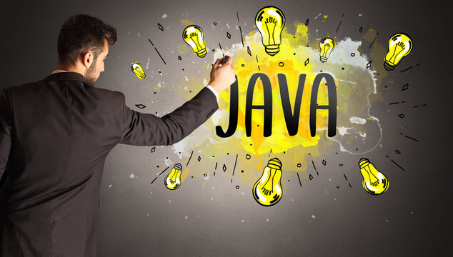 man drawing colorful light bulb
