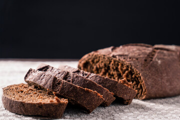 Fresh dark sliced bread. Text space