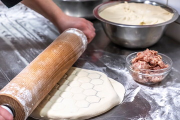 Fototapeta premium The chef cooking dumplings with meat