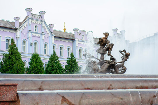Sumy, Ukraine. August 22. 2014. Sadko Fountain with sculpture and water cascade. Banking Academy in the background