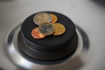 Euro on gas stove, switched off stove. Cooking and heating too expensive