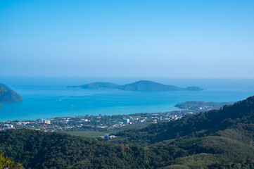Beautiful turquoise sea and blue sky from high view point at Phuket, Thailand.