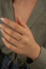 Obraz na płótnie Canvas Heart diamond ring, look of a girl wearing beautiful jewelery with precious stones.