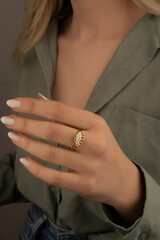 Obraz na płótnie Canvas Heart diamond ring, look of a girl wearing beautiful jewelery with precious stones.