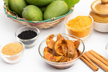 Mango Pickle Also Known As Aam Ka Achar, Aam Chunda, Maagaya, Avakaya, Urakaya, Kadumanga Achar Is Made Of Raw Unripe Green Mangoes And Assorted Indian Spices Masala. White Backgronund With Copy Space