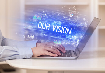 Closeup of businessman hands working on laptop
