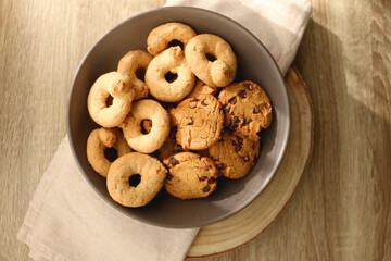 Plate of sugar cookies and chocolate chip cookies on the table. Flat lay.