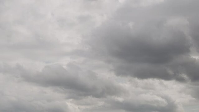Time Lapse Gray White Cloudy Sky Covered with Gray Rain and White Clouds after Summer Rain on Summer Day, Sunlight Breaks Through the Sky. Weather, Climate, Summer Post-Rain Skycraper.