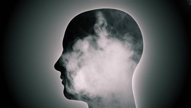 Human head with smoke and clouds inside. Concept of open mind, calmness, meditation, creativity