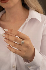 Heart diamond ring, look of a girl wearing beautiful jewelery with precious stones.