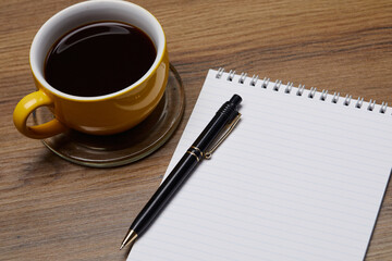notebook on the table and coffee