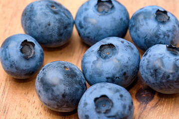 Harvested blueberry fruit (Wooden Plate Background)