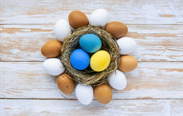 multi colors painted easter eggs in colors flag of ukraine yellow and blue. Happy Easter holiday card	
