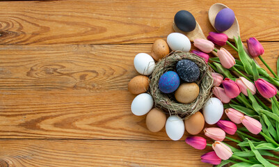 black colors painted easter eggs in decor nest. Happy Easter holiday card	
