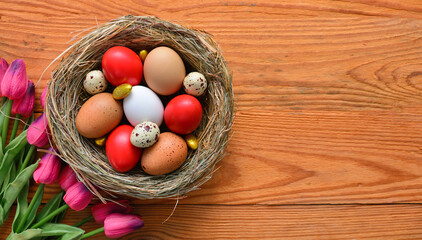 Easter background with dark red Easter eggs. Top view with copy space	

