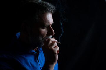 Handsome Men Light Up a Cigarette