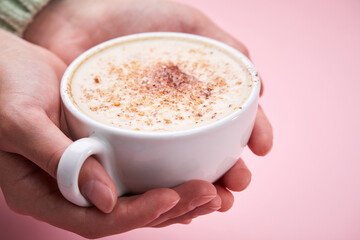 woman with cup of cappuccino