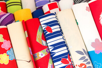 Fototapeta premium A pile of colorful fabrics at the entrance of a store at Asakusa, Tokyo, Japan