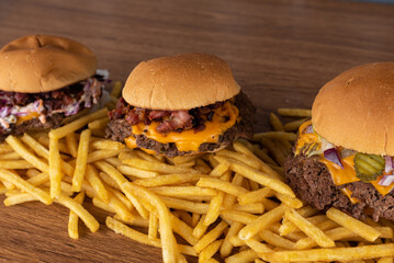 Smash burger trio on top of fries