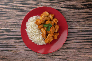 Meal - Chicken breast with pieces of mozzarella cheese and white rice