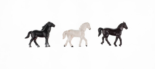 toy three horses isolated on white background