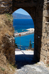 the main gate of the Castle of Koroni with the harbour in the background. A coastal town in Messenia, Peloponnese, Greece. 