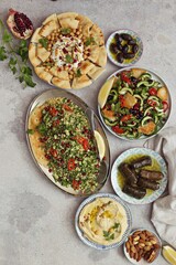 Traditional Lebanese dishes assortment. Chickpea Fatteh, Tabbouleh, Fattoush Salad, Hummus and various of appetizers. Flat layot, selective focus