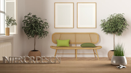 Wooden table, desk or shelf with potted grass plant, house keys and 3D letters making the words interior design, over wooden rattan waiting room project concept copy space background