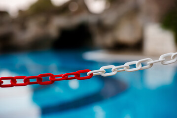 Chains and swimming pool backdrop