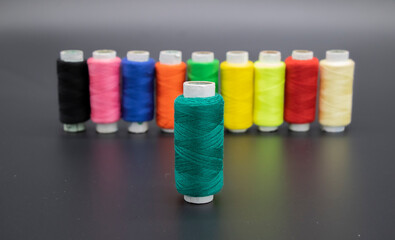 selective focus on DarkCyan, spool Colorful yarn on spool, yarn on tube, cotton, wool, linen...