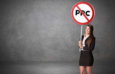 Young business person holdig traffic sign