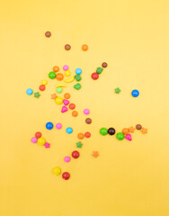 candie pieces isolated on yellow background