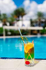 Tasty cocktail background swimming pool