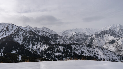 Snowy mountains on a cloudy day