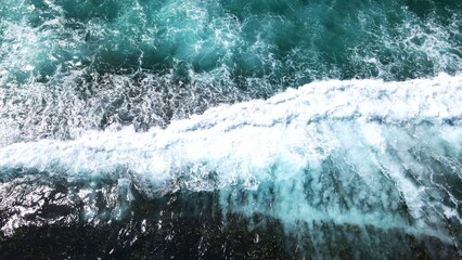 Obraz na płótnie Canvas Aerial view of ocean waves on beautiful Brazilian beach