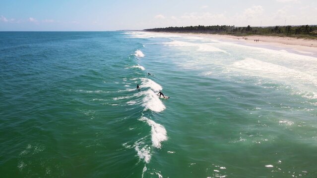 Surfist catching waves on brazilian beach