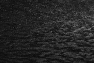 Black coarse texture. Black plastic background
