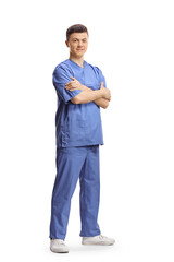 Full length shot of a young male intern worker in a blue uniform posing with crossed arms