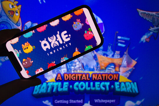 KONSKIE, POLAND - April 02, 2022: Axie Infinity nft online video game logo on mobile phone