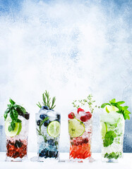 Summer cocktails or mocktails and cold drinks. Refreshing mojito drink with blueberries,...