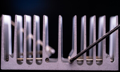 Anodized aluminum coolers isolated on black background. Alu heat sinks for cooling of electronic...