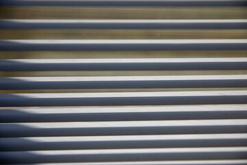 Closed blinds from the light in the room.