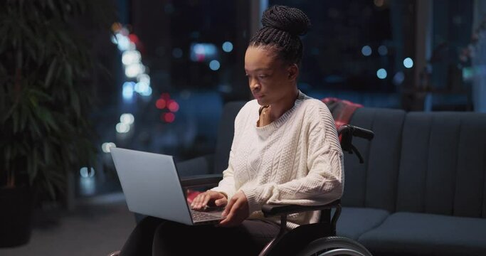 Serious young african beautiful girl with disabilities calling recruting agency applying for job interviewing online sitting in wheelchair. Disabled person. Videochatting.