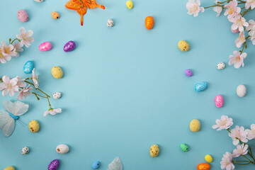 Blue Easter holiday background with eggs flowers