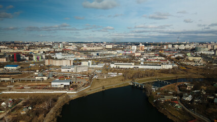 Fototapeta premium Mixed urban development. Industrial and residential area. Water city system. Aerial photography.