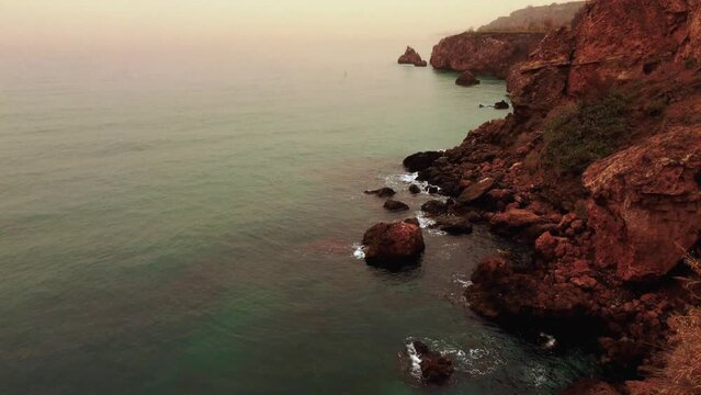 Calima fog day in Maro beach in the mediterranean coast